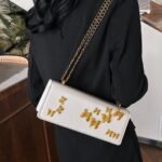 PU leather shoulder bag features decorative gold-toned butterfly embellishments and a matching gold chain strap - Image 4