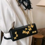 PU leather shoulder bag features decorative gold-toned butterfly embellishments and a matching gold chain strap - Image 3